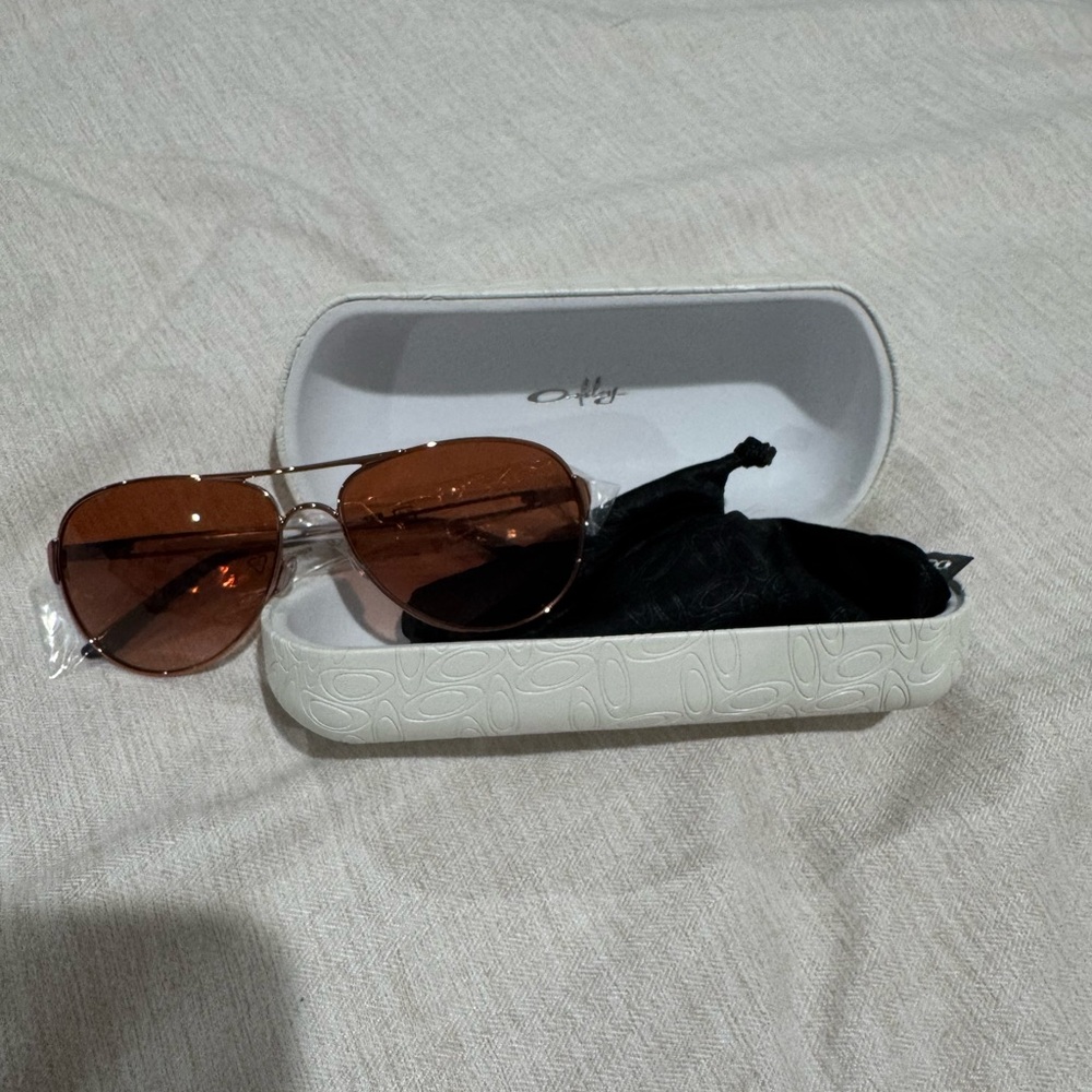 Oakley Silver Frame Sunglasses with Brown Lenses